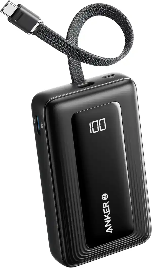 Anker power bank placed on a desk, showcasing its sleek black design, USB-C and USB-A ports, ideal for charging smartphones and laptops on the go