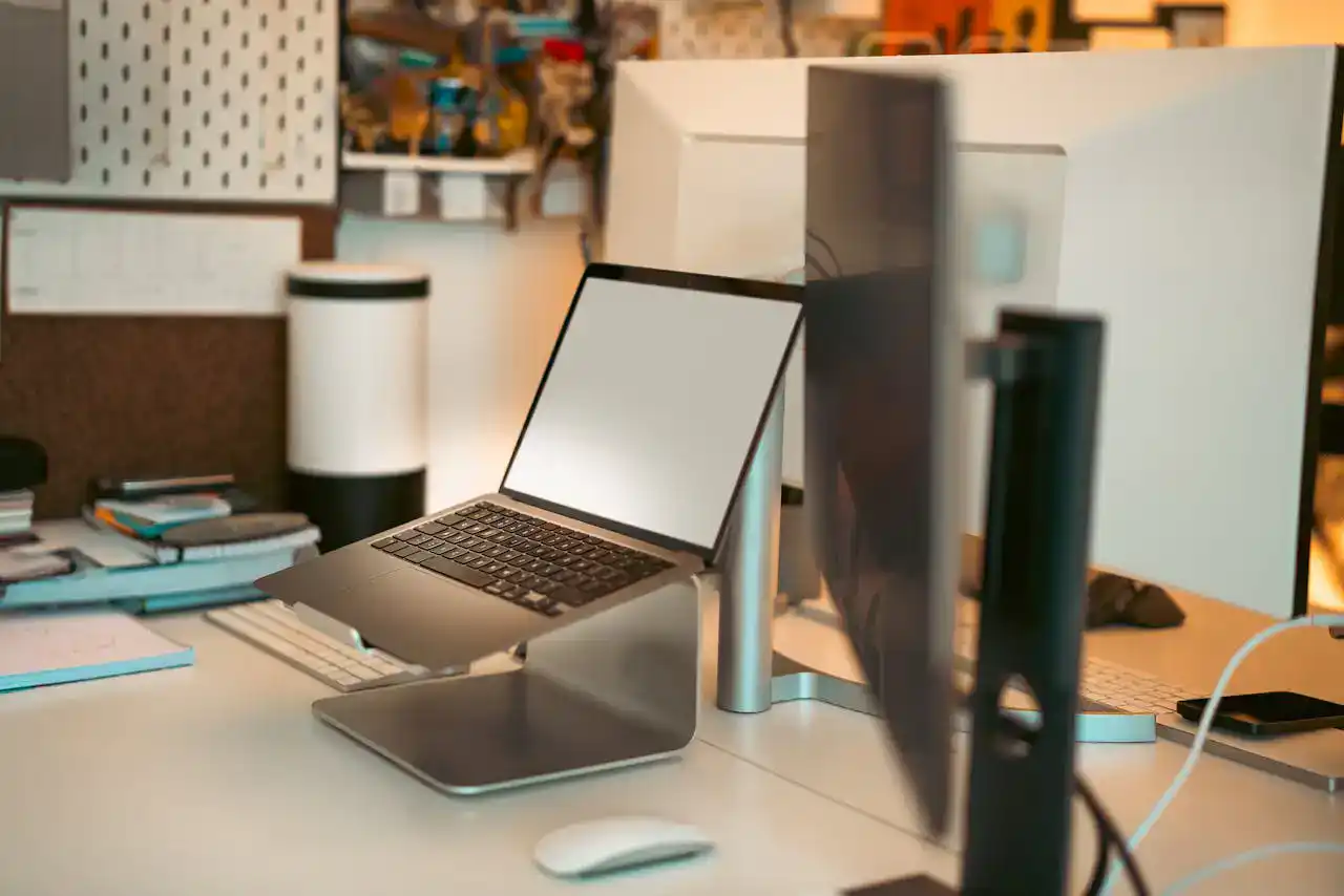 A laptop on a compact laptop table for home office setup, ideal for small spaces and remote work productivity.