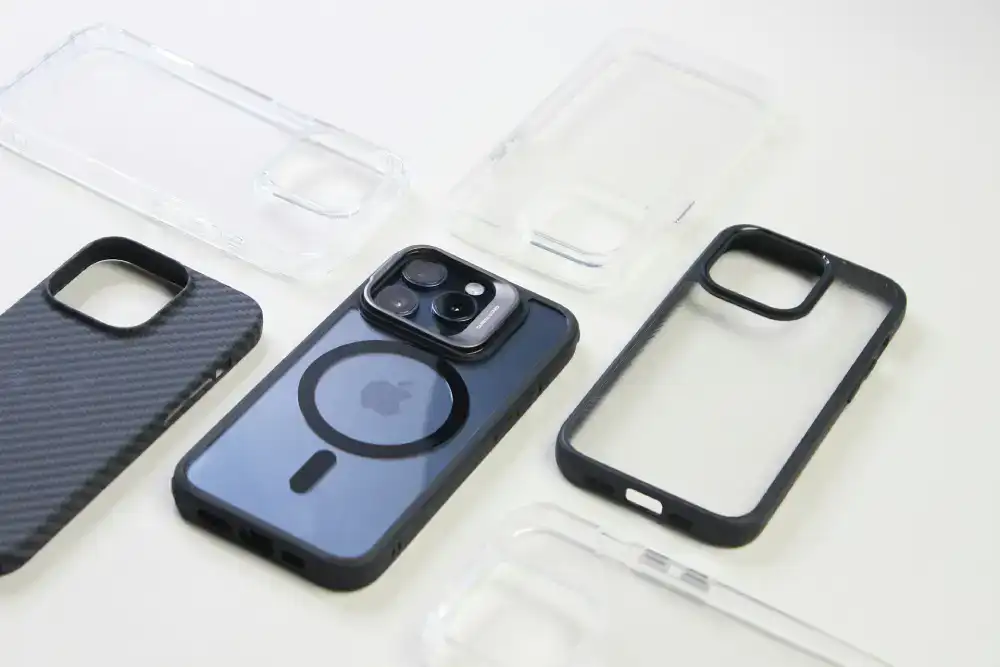 Multiple transparent phone cases displayed neatly on a table, showcasing different designs and styles